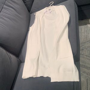 White duster vest.